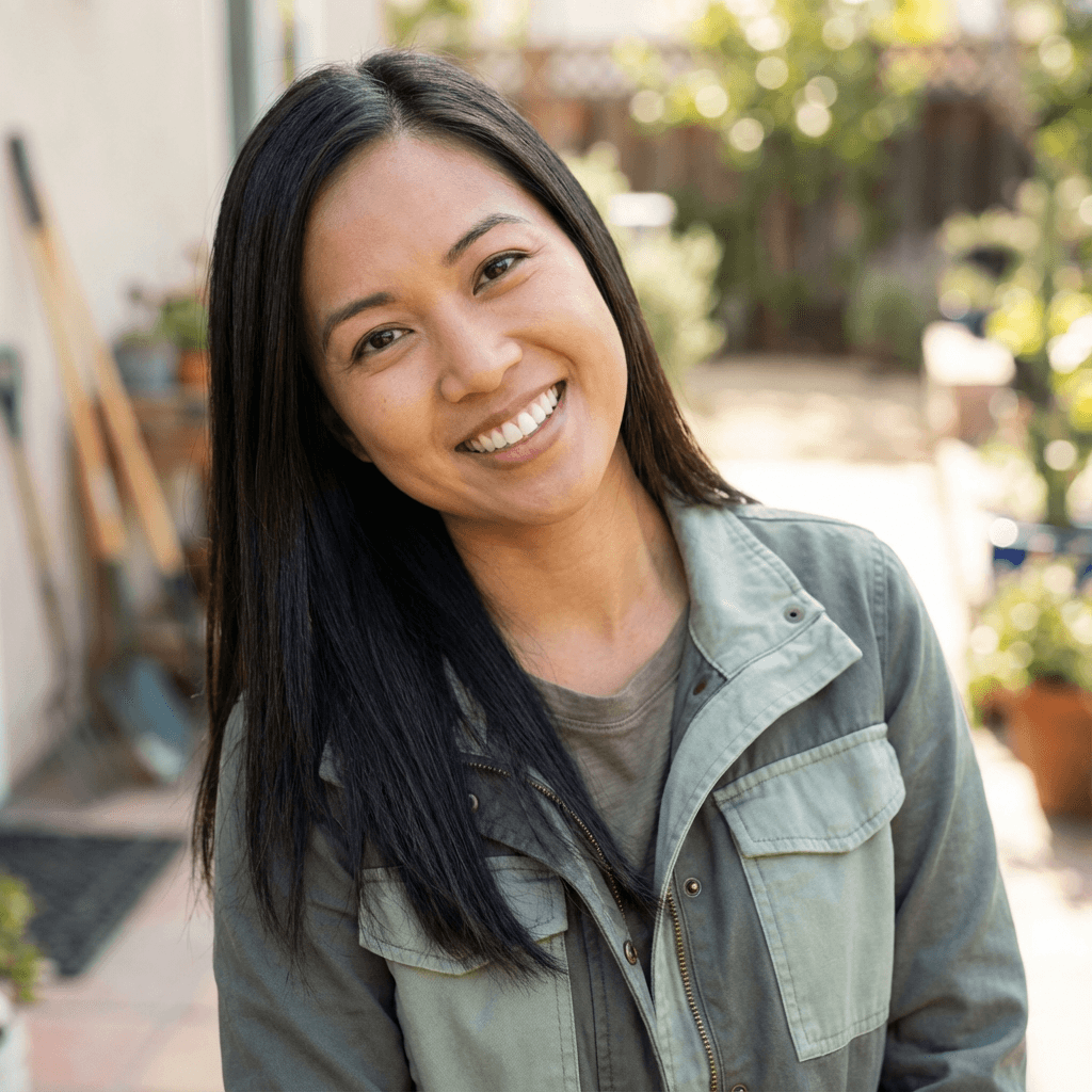 Karen Nguyen in a casual top by her car
